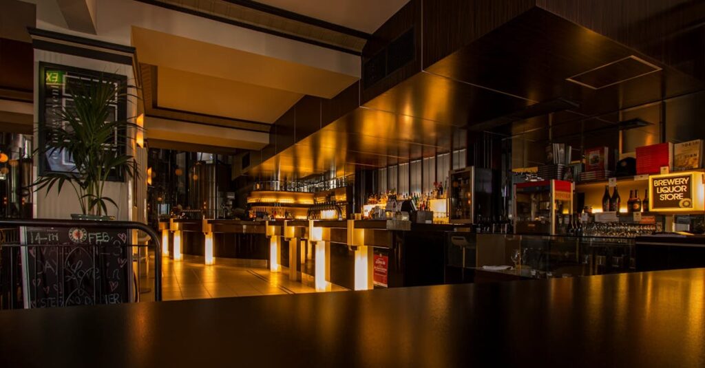 Stylish modern restaurant interior with warm lighting, elegant design, and luxurious ambiance at night.