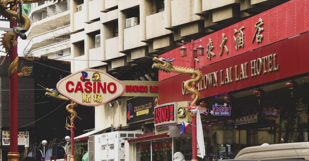 Bustling street scene in Manila's Chinatown featuring casino signage and vibrant urban life.