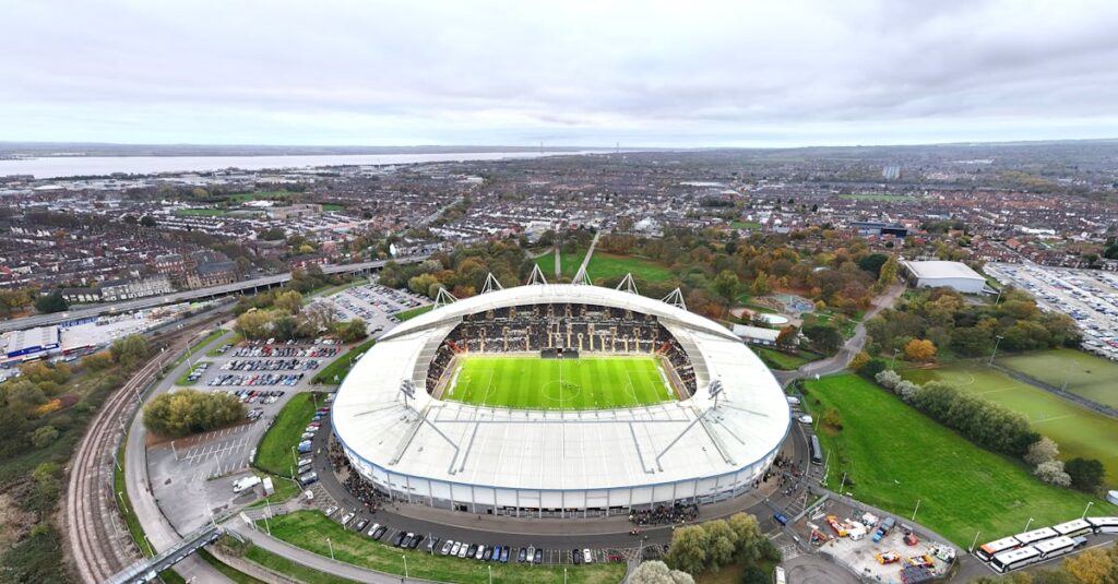 Aerial view of MKM Stadium in Hull, England, bustling with fans on match day.